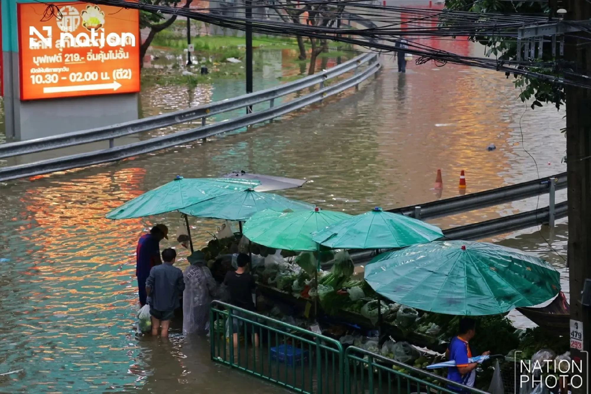 Floods block small cars on Bangkok’s Lat Phrao as storms forecast across 80% of area