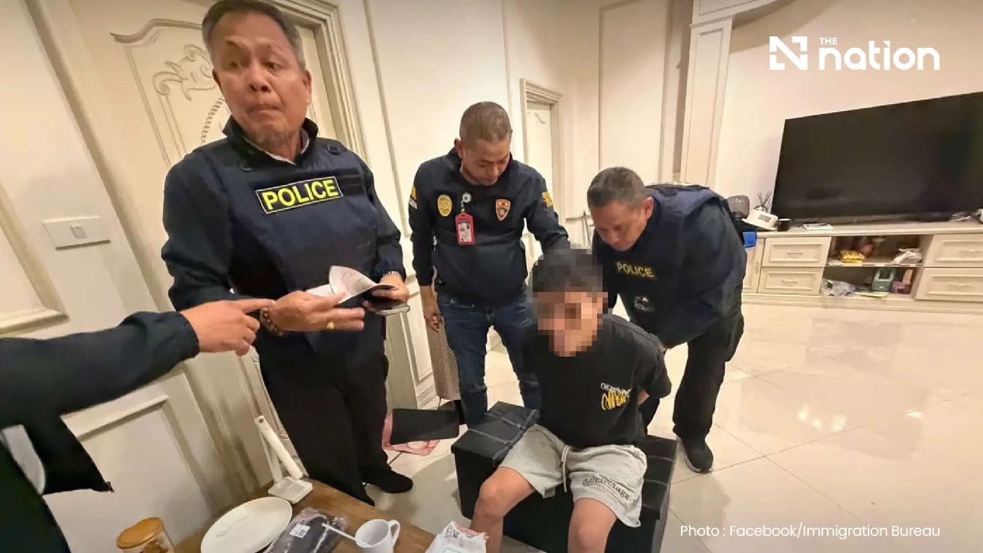 Police detain 14 in scam raid at Bangkok mansion worth over THB270m