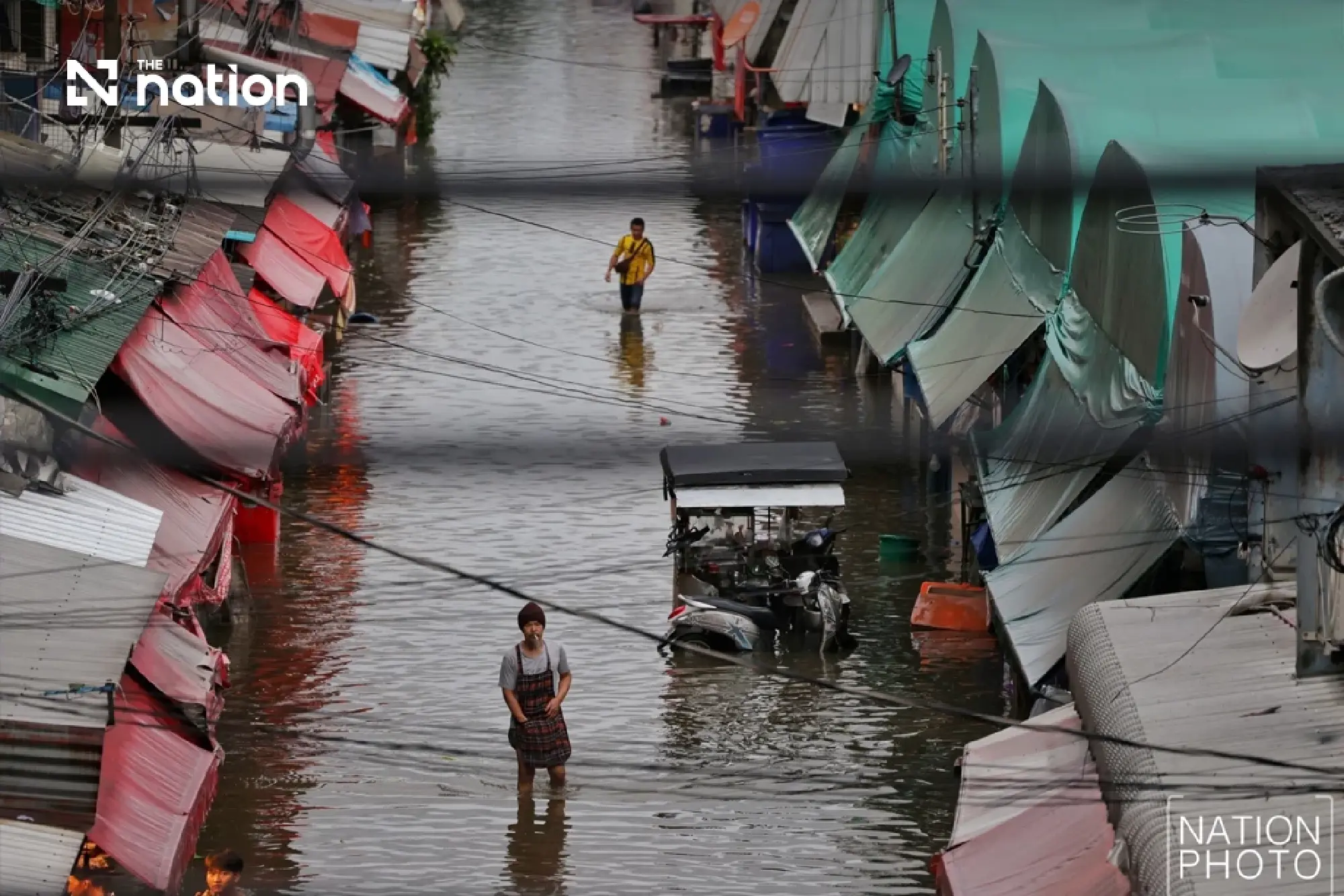 Floods block small cars on Bangkok’s Lat Phrao as storms forecast across 80% of area