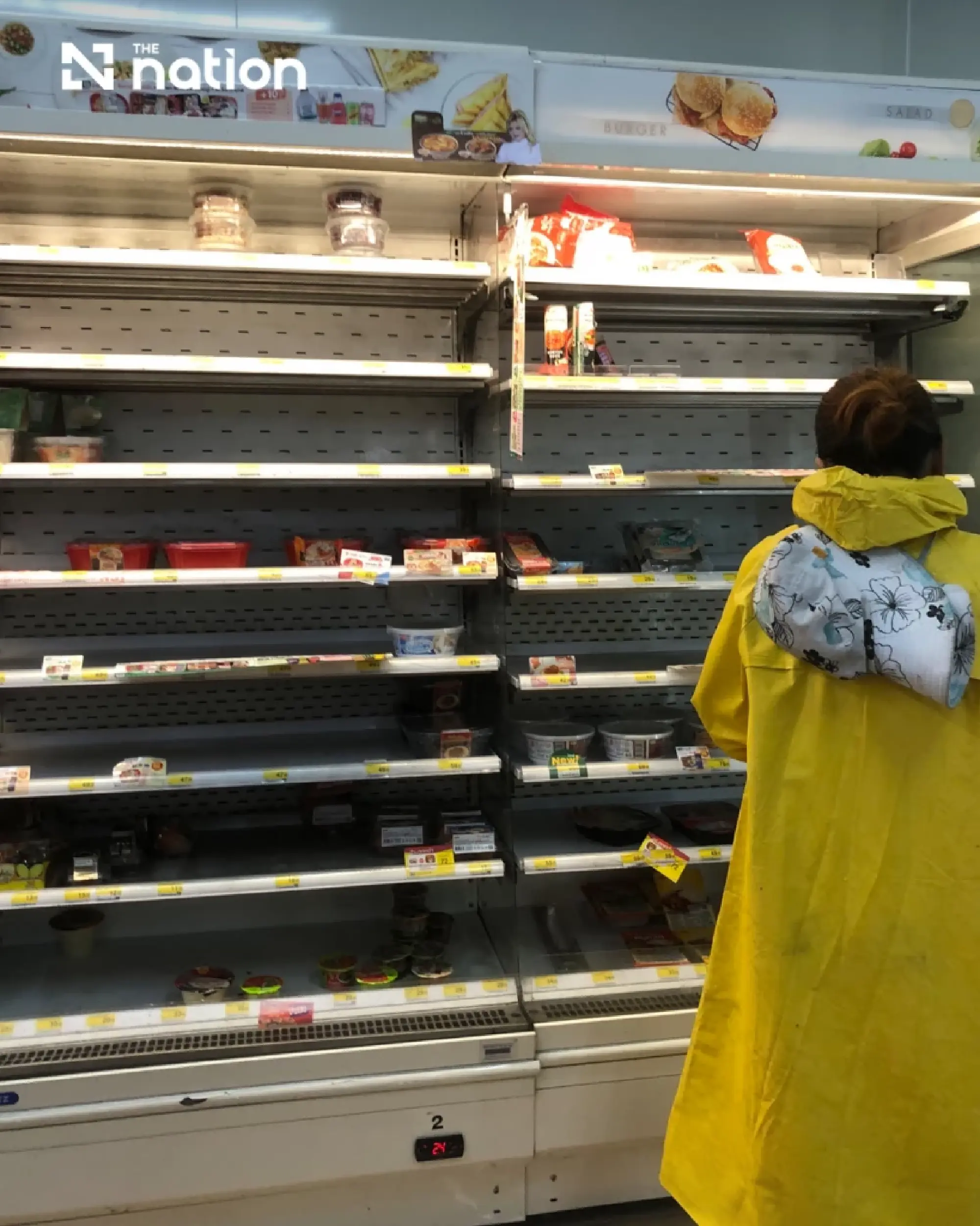 Bangkok shoppers stock up as flooding empties convenience-store shelves