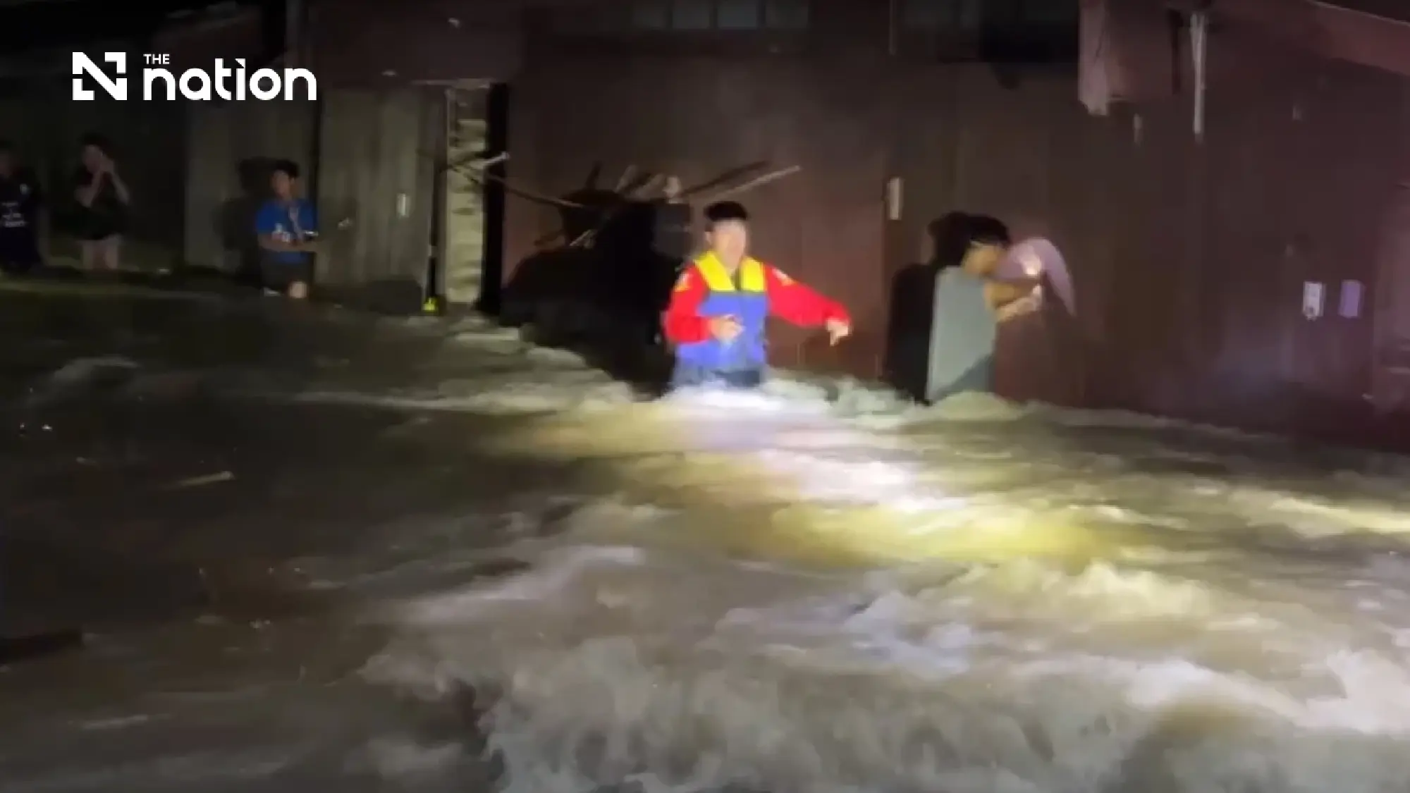 Rescuers evacuate bedridden patients as overnight floods hit almost 100 homes in Phetchaburi