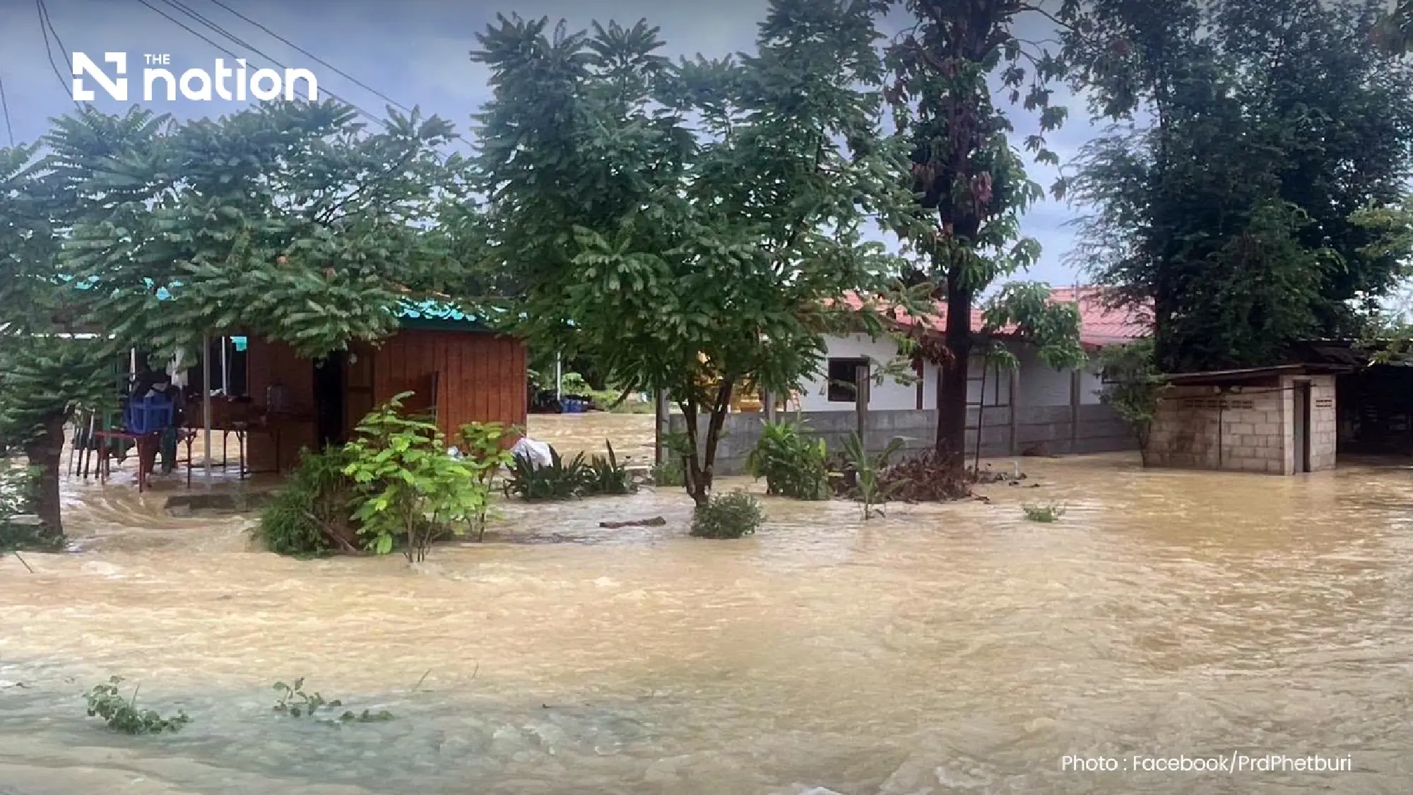 Rescuers evacuate bedridden patients as overnight floods hit almost 100 homes in Phetchaburi
