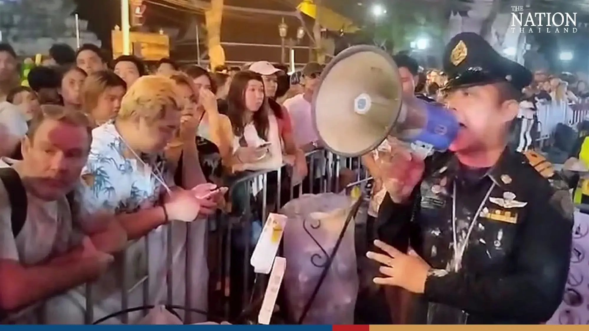 Police stop partygoers entering crowded Khao San on first day of Songkran - Photo 5