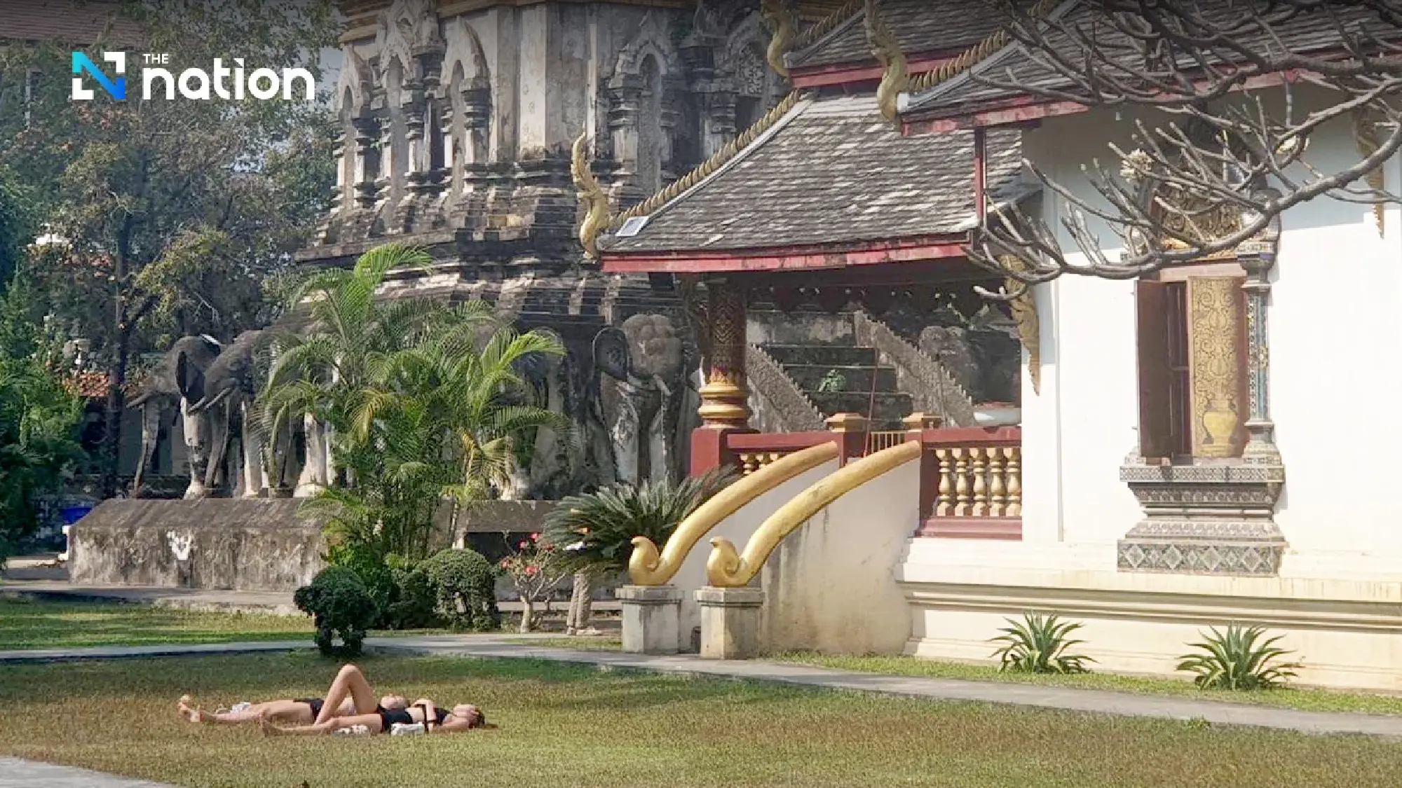 Social media explodes over foreign sunbathers at Chiang Mai temple - Photo 7