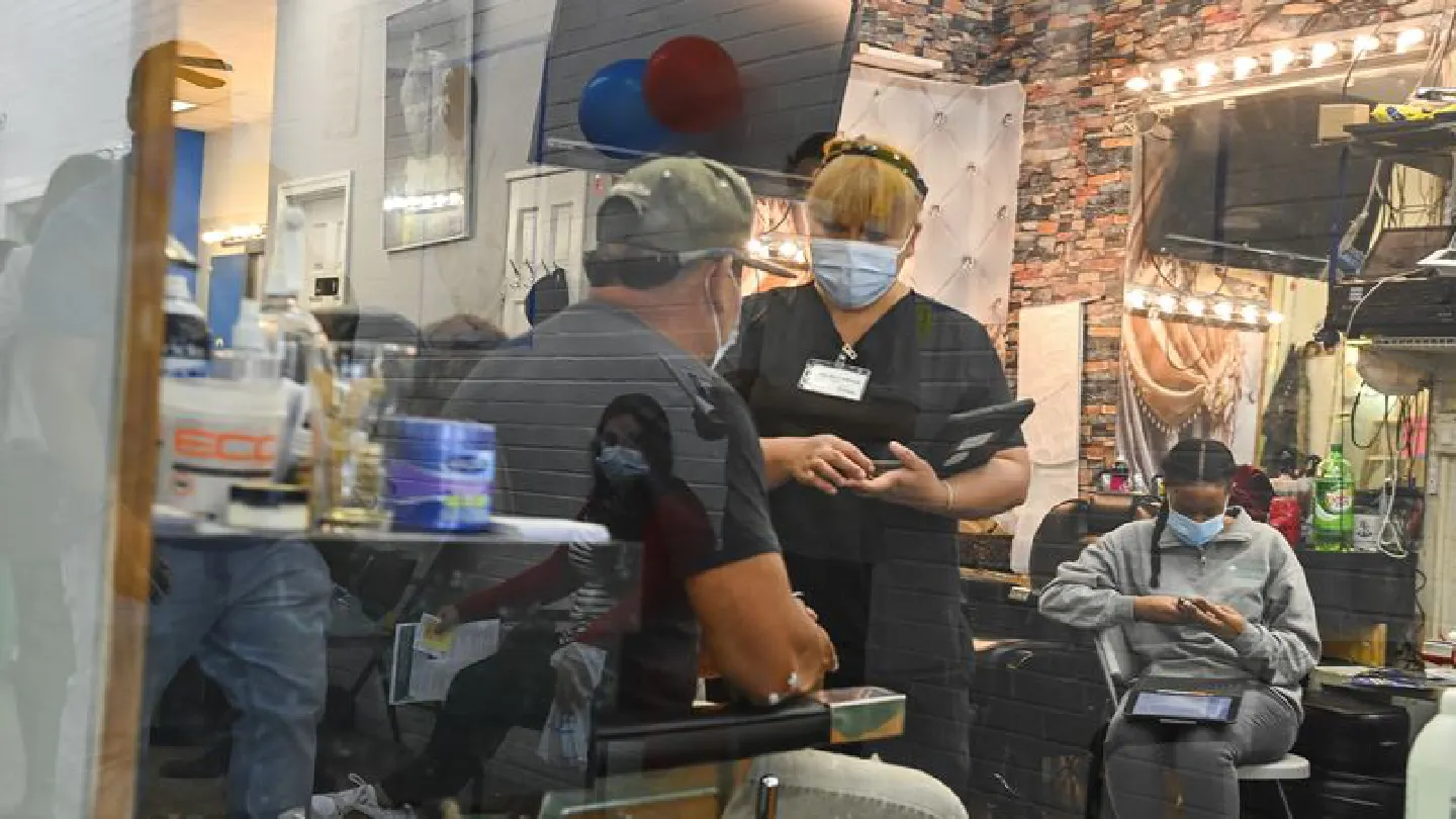 Barbershop offers coronavirus shots, in addition to cuts and shaves. Some see it as a national model.