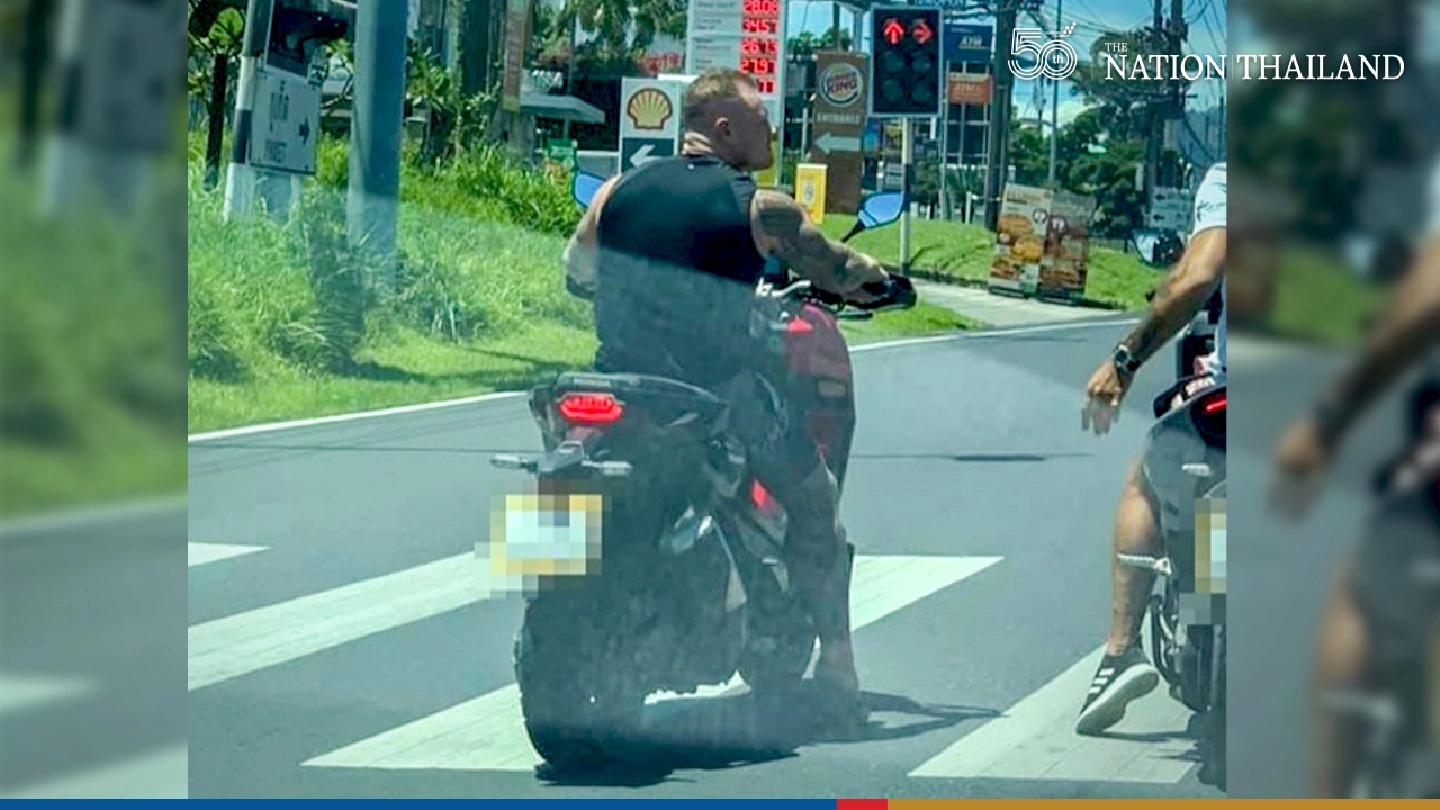 Phuket police find foreigner seen riding bike without mask and showing middle finger