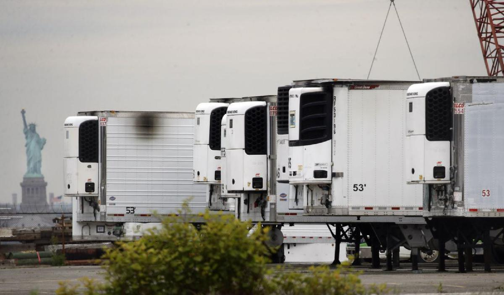 Hundreds of bodies of coronavirus victims lie in refrigerated trucks more than a year into the pandemic