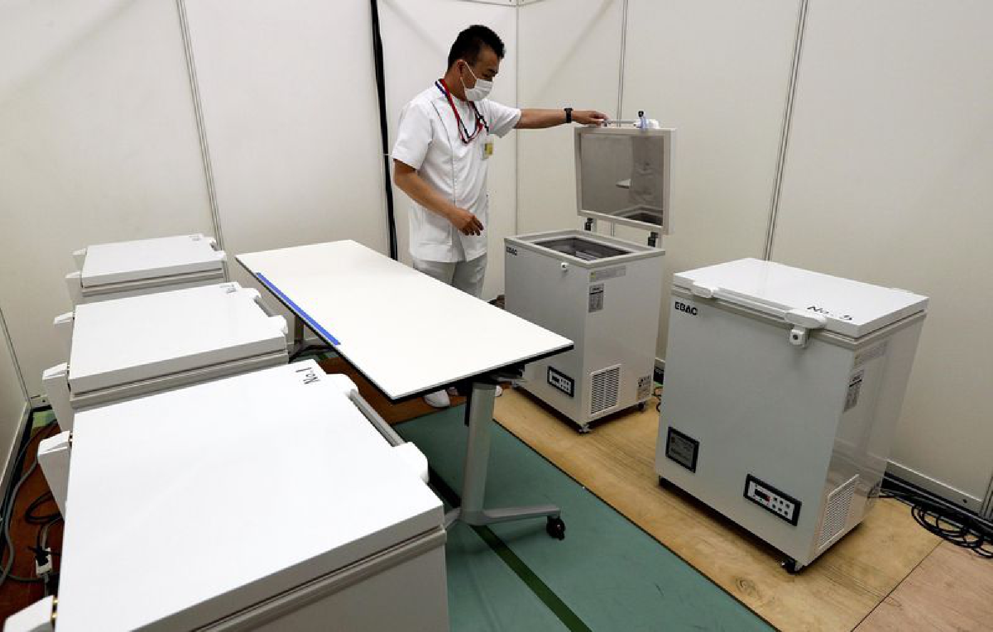 Japan govt to provide COVID-19 vaccine, freezers for workplace inoculations