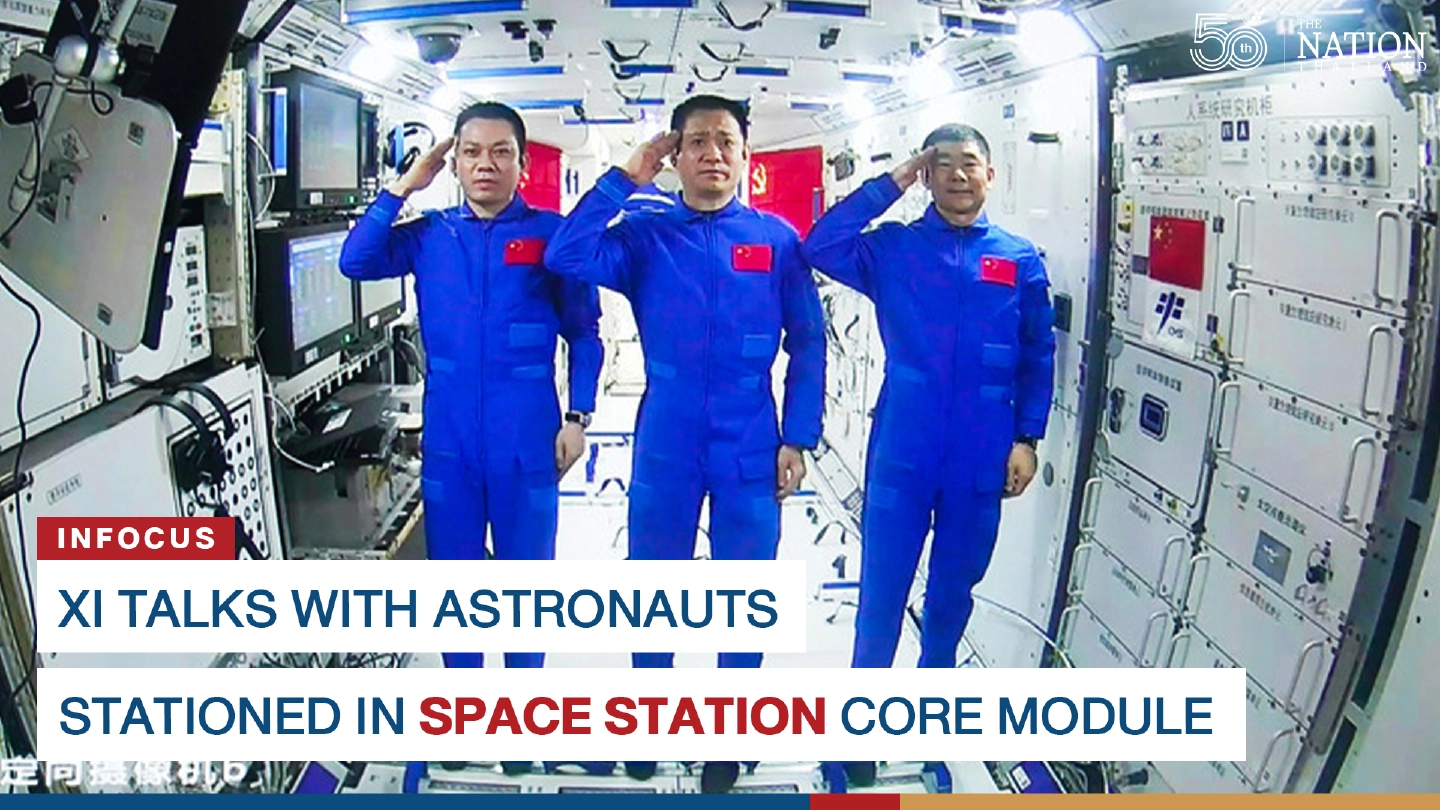 Xi talks with astronauts stationed in space station core module.