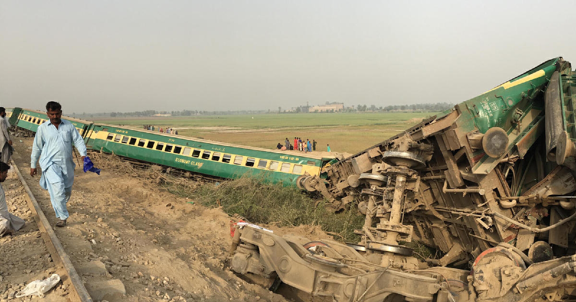 Trains crash in Pakistan, killing at least 32, as rescuers try to free survivors