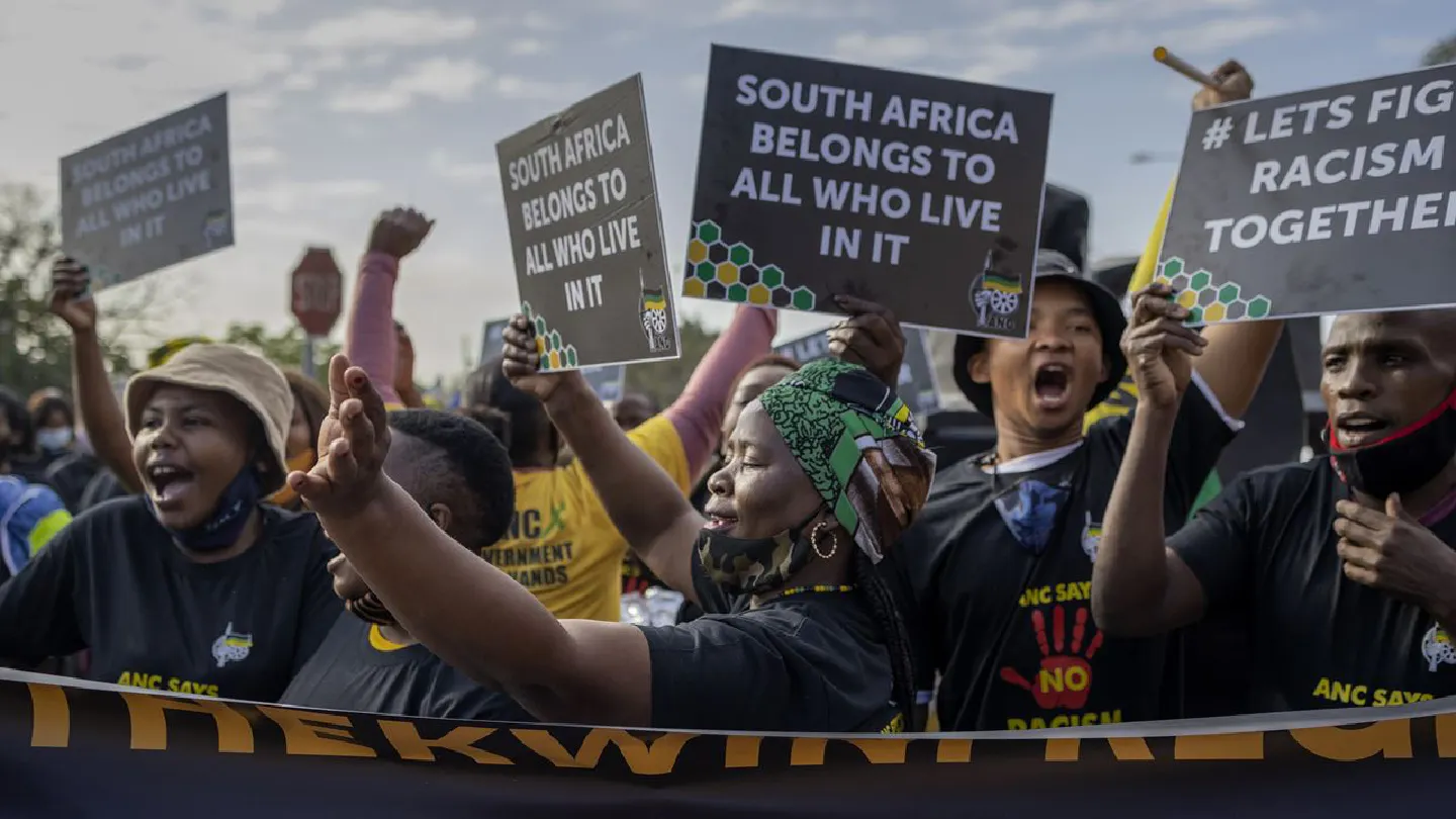 In a sudden bout of racial killings, a South African suburb sees a dark history repeating itself