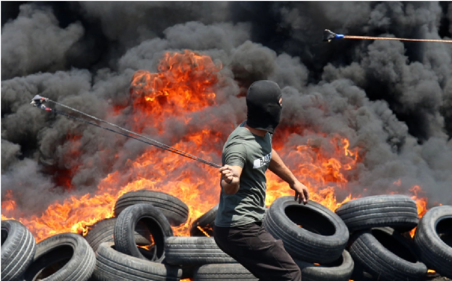 Mideast in Pictures: Palestinians clash with Israeli soldiers over settlement expansion in Nablus