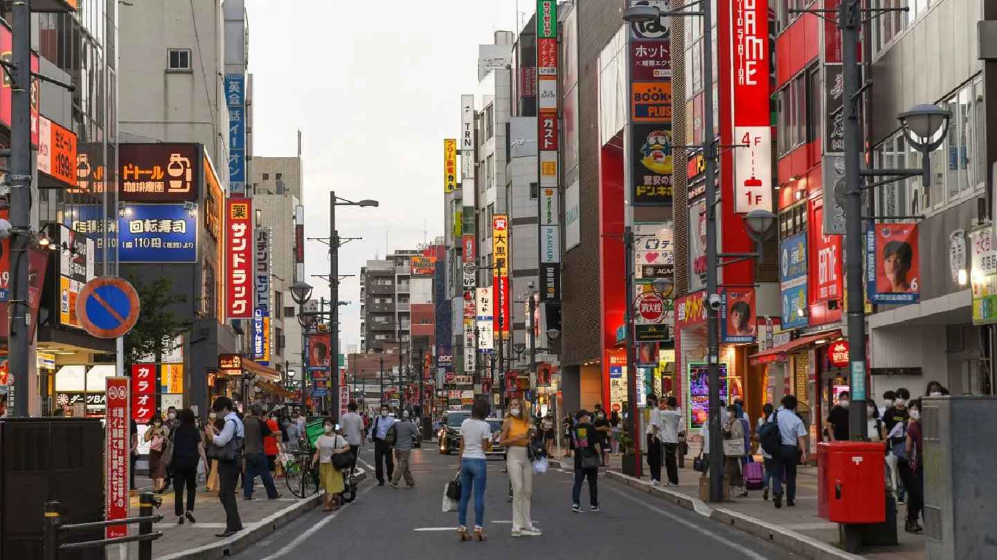 Japan expands virus emergency to 70% of population on Covid surge