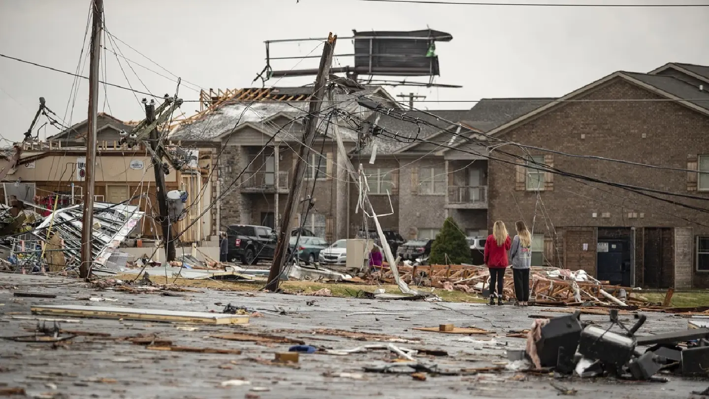 Scores killed as tornadoes rake six states