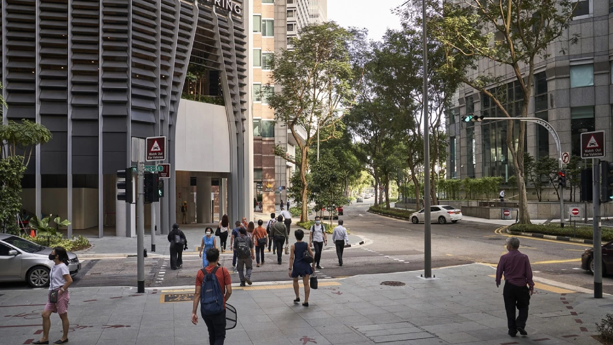 Singapore warns of omicron wave as workplace rules eased