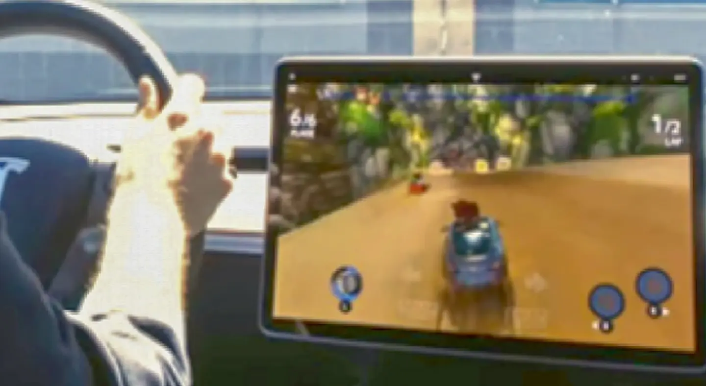 Federal regulators probing Tesla over drivers ability to play video games in moving cars