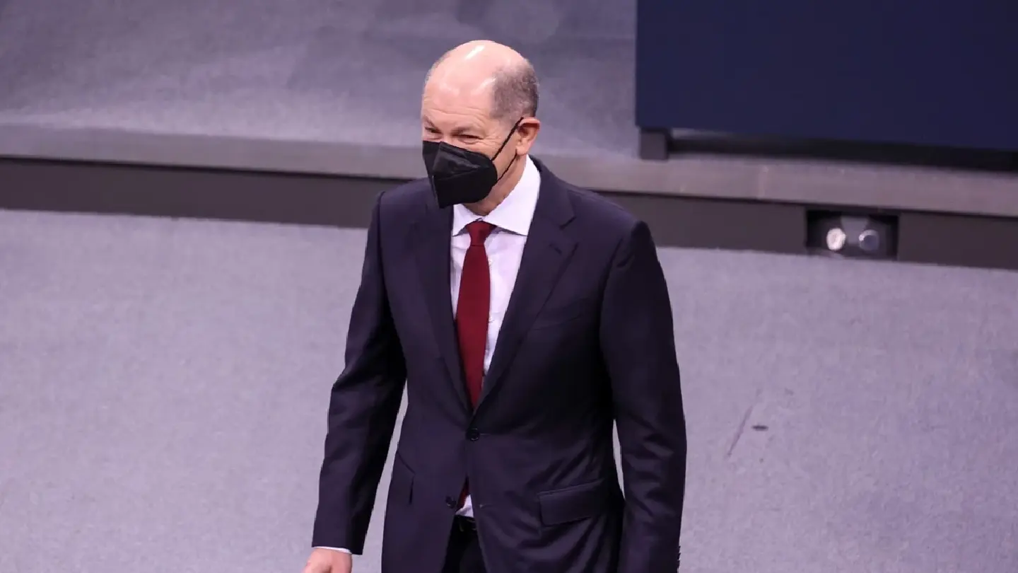 Olaf Scholz becomes chancellor as Germany faces Covid, Russia risks