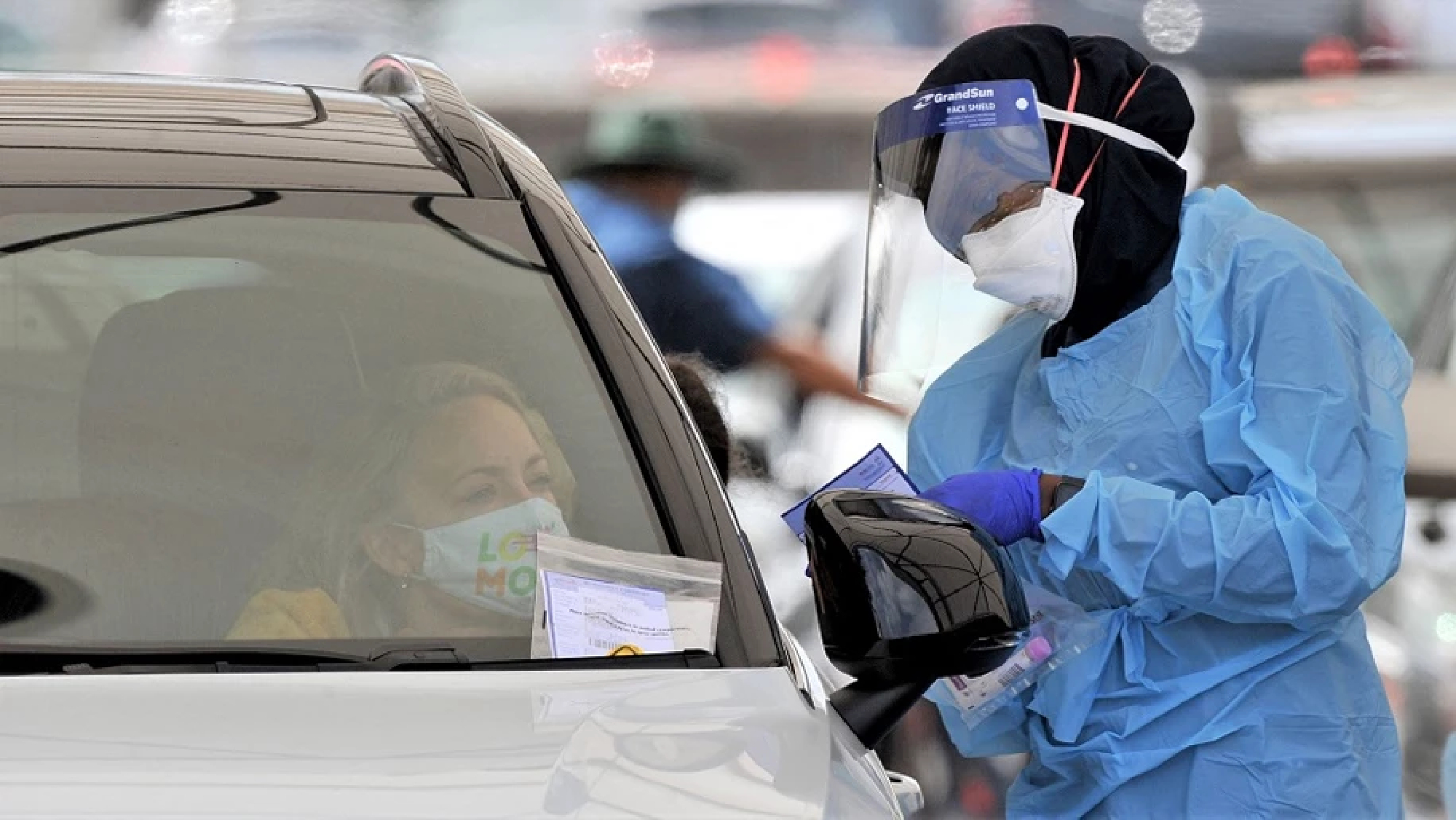 Masks return to Australian cities as omicron sours Christmas