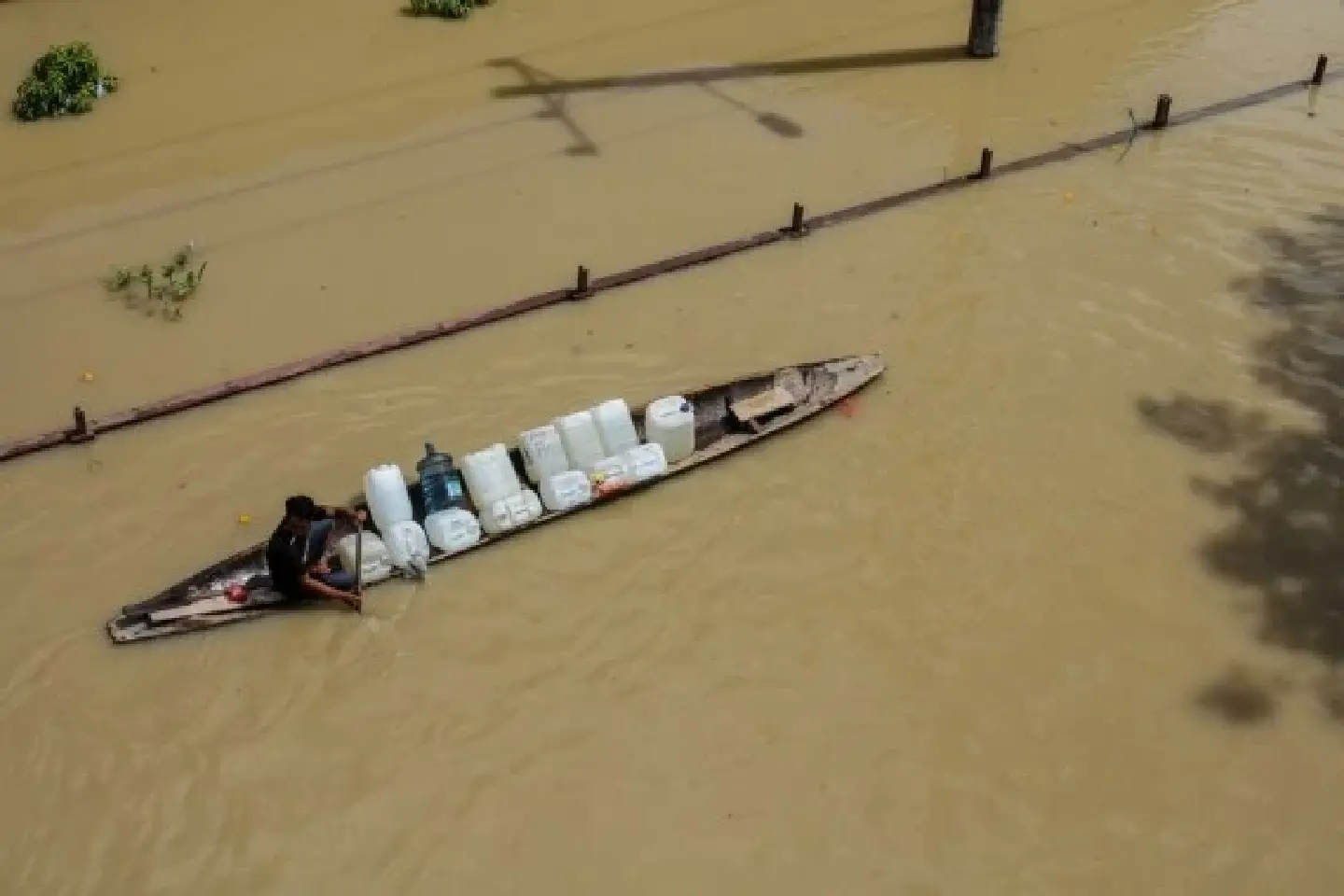 "Boats paddle through the streets" -- Heavy flood hits Indonesia
