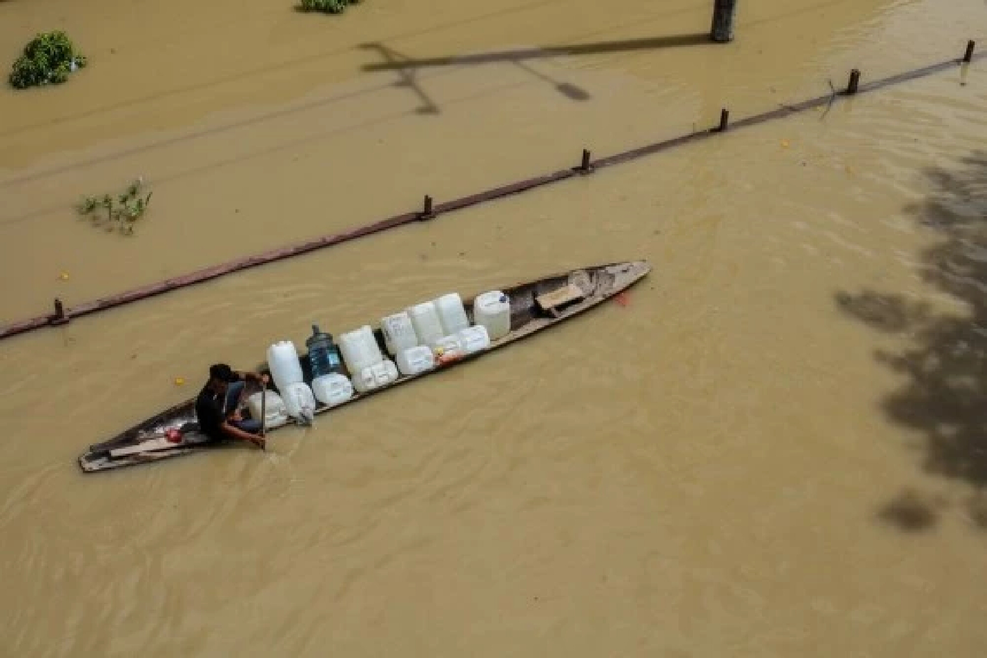 "Boats paddle through the streets" -- Heavy flood hits Indonesia