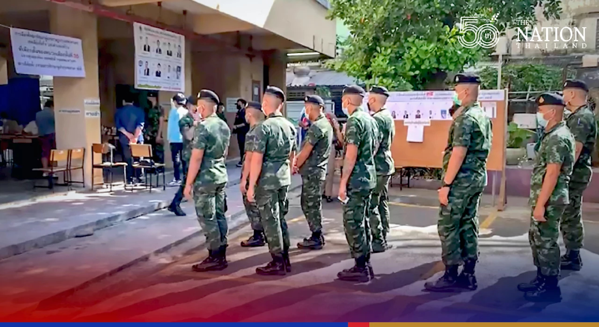 Soldiers line up to vote as polling booths open in Bangkok