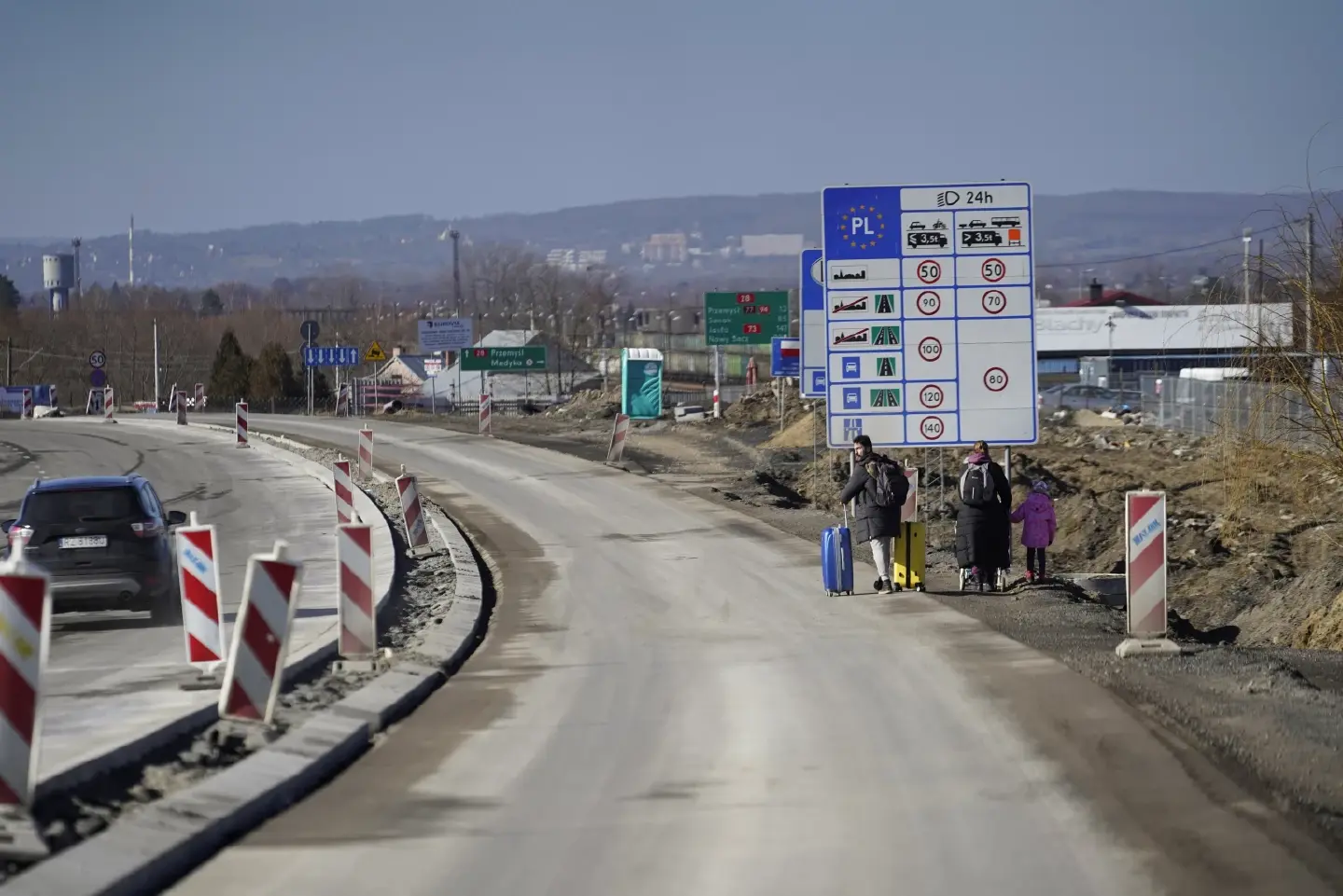Ukrainians flee to Poland after Russian military attack
