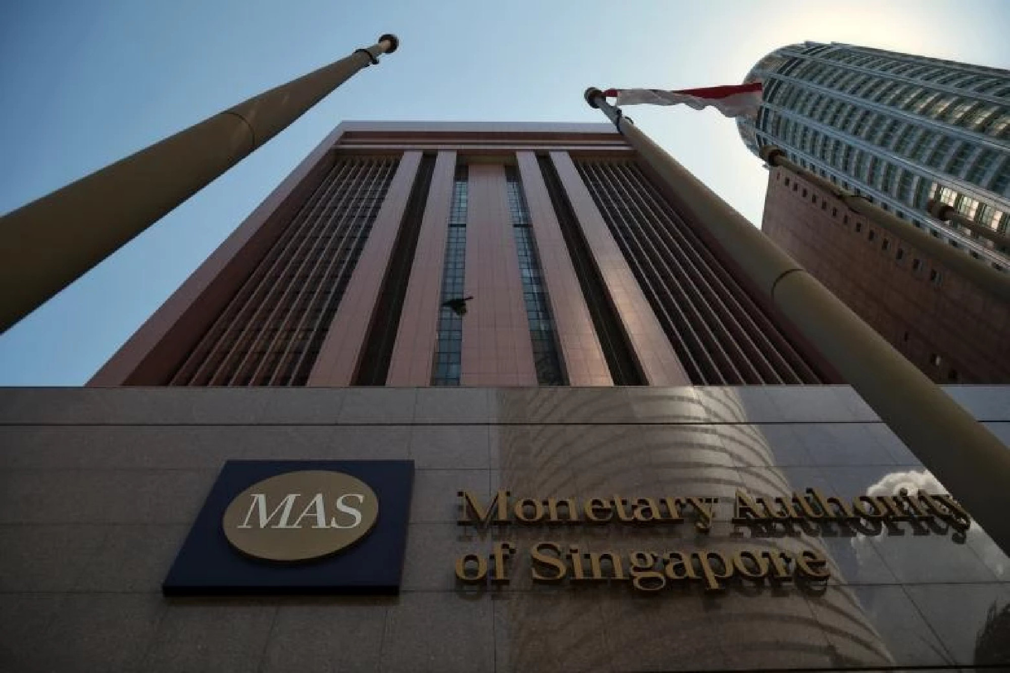 MAS issues details of Russia sanctions that include digital payment curbs