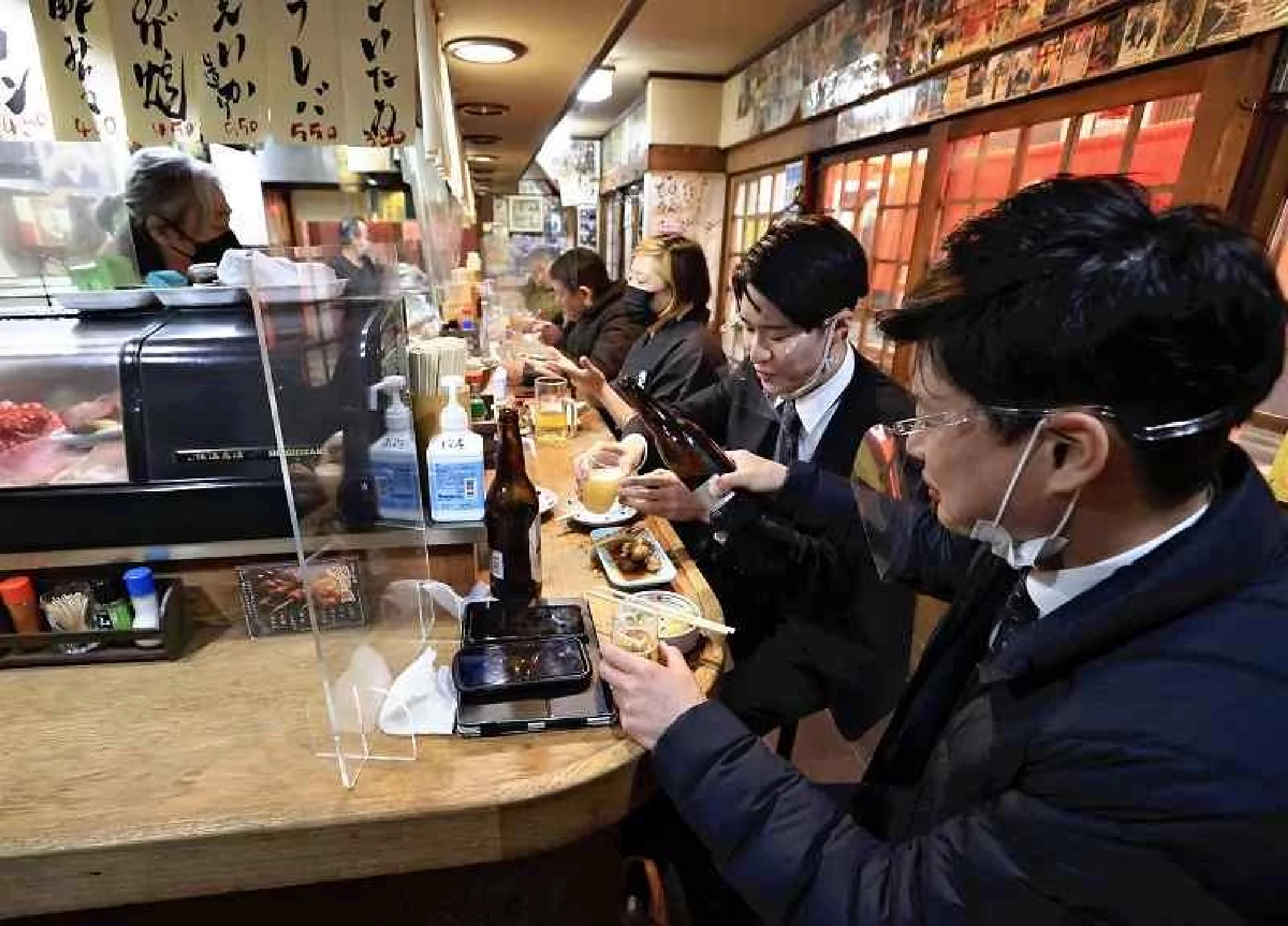 Tokyo to ease COVID-linked group dining restriction