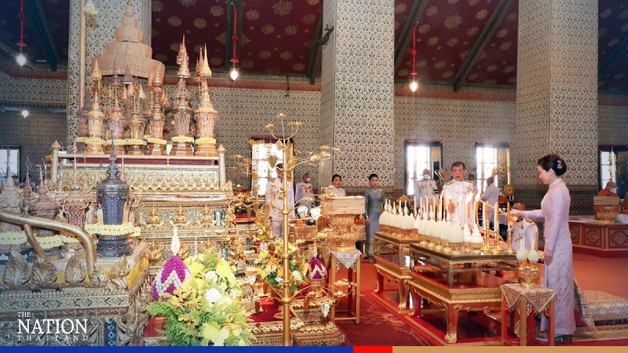 Their Majesties attend Songkran merit-making ceremony