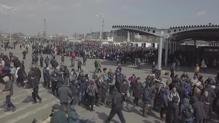 Drone footage shows people queueing for humanitarian aid in besieged Mariupol