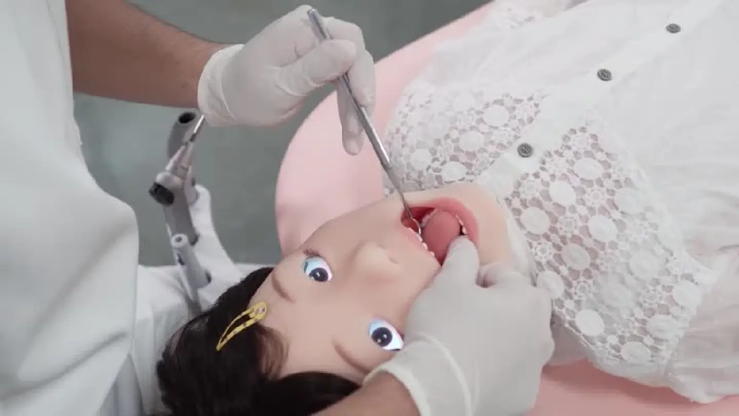 Lifelike "child" robot helps train pediatric dentists in Japan