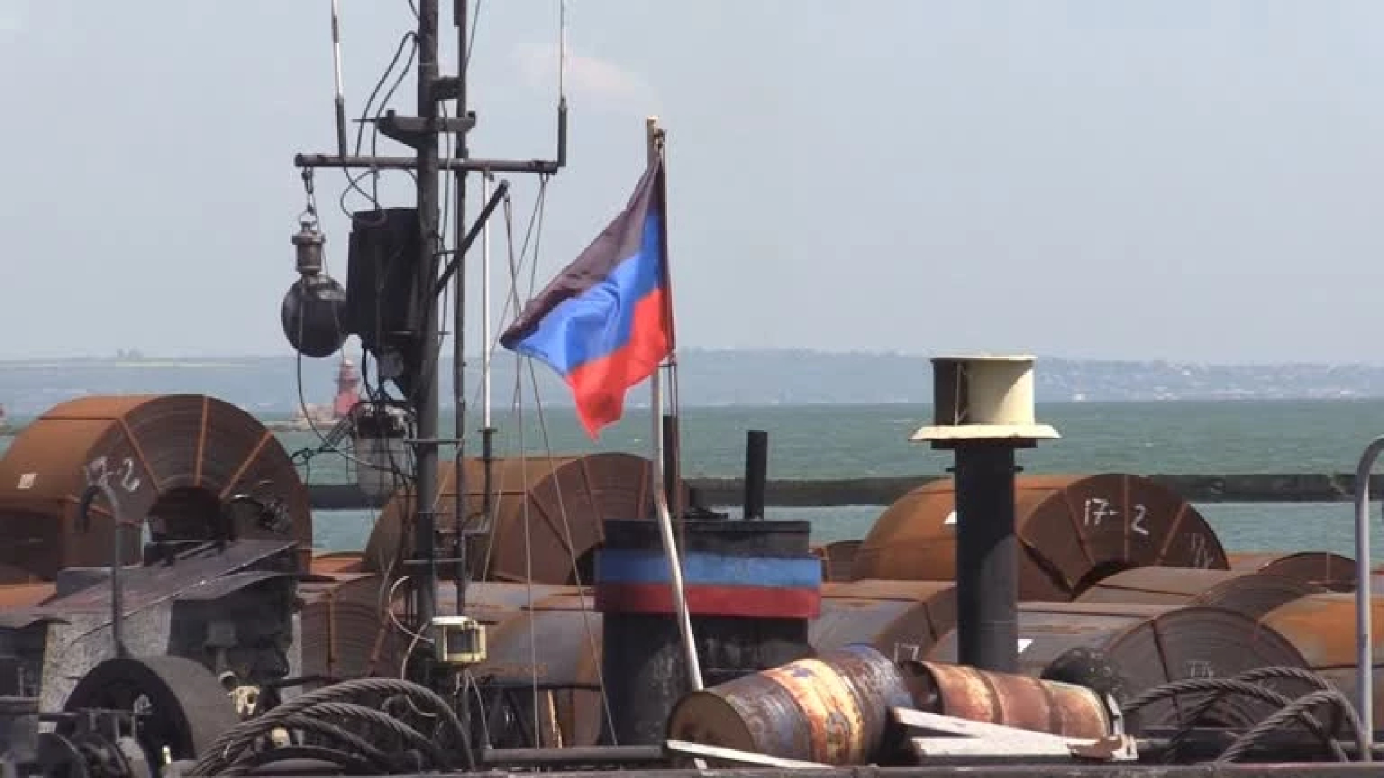 Russian vessel loaded with steel docked at Mariupol port as Kyiv decries looting