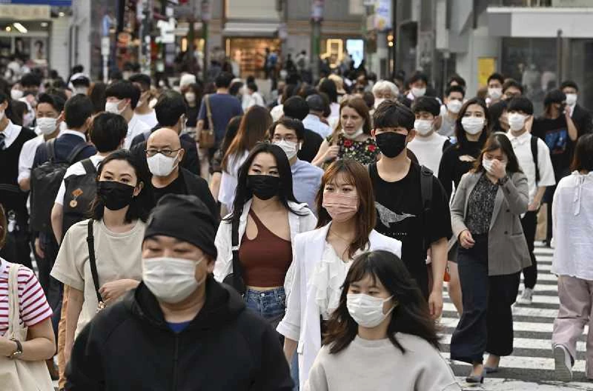 Japan's health minister: Masks not needed outdoors, if you keep quiet