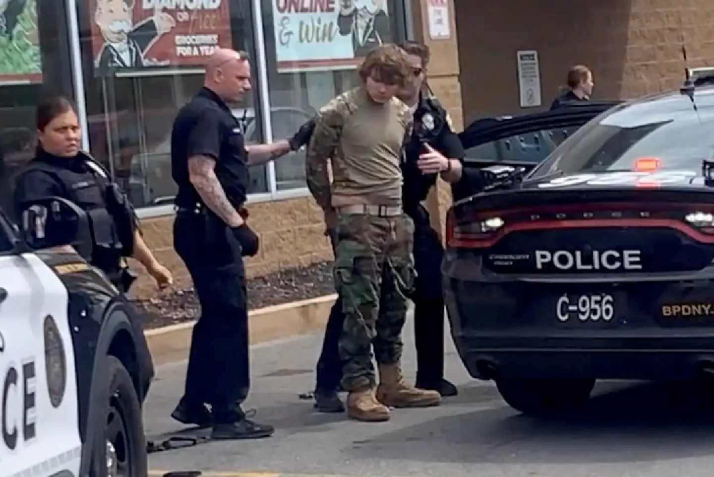 ‘Racist’ suspect in court after mass shooting at US supermarket