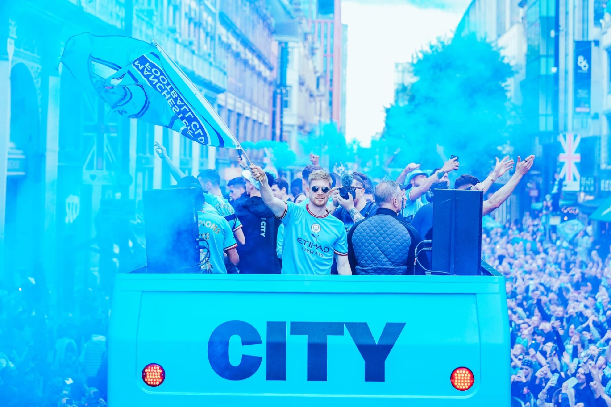 Champions Manchester City paint town blue with open top bus parade