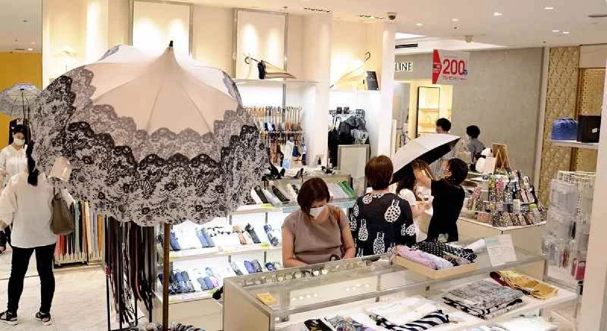 Scorching weather in Japan prompts early spike in sales of parasols, sunscreens