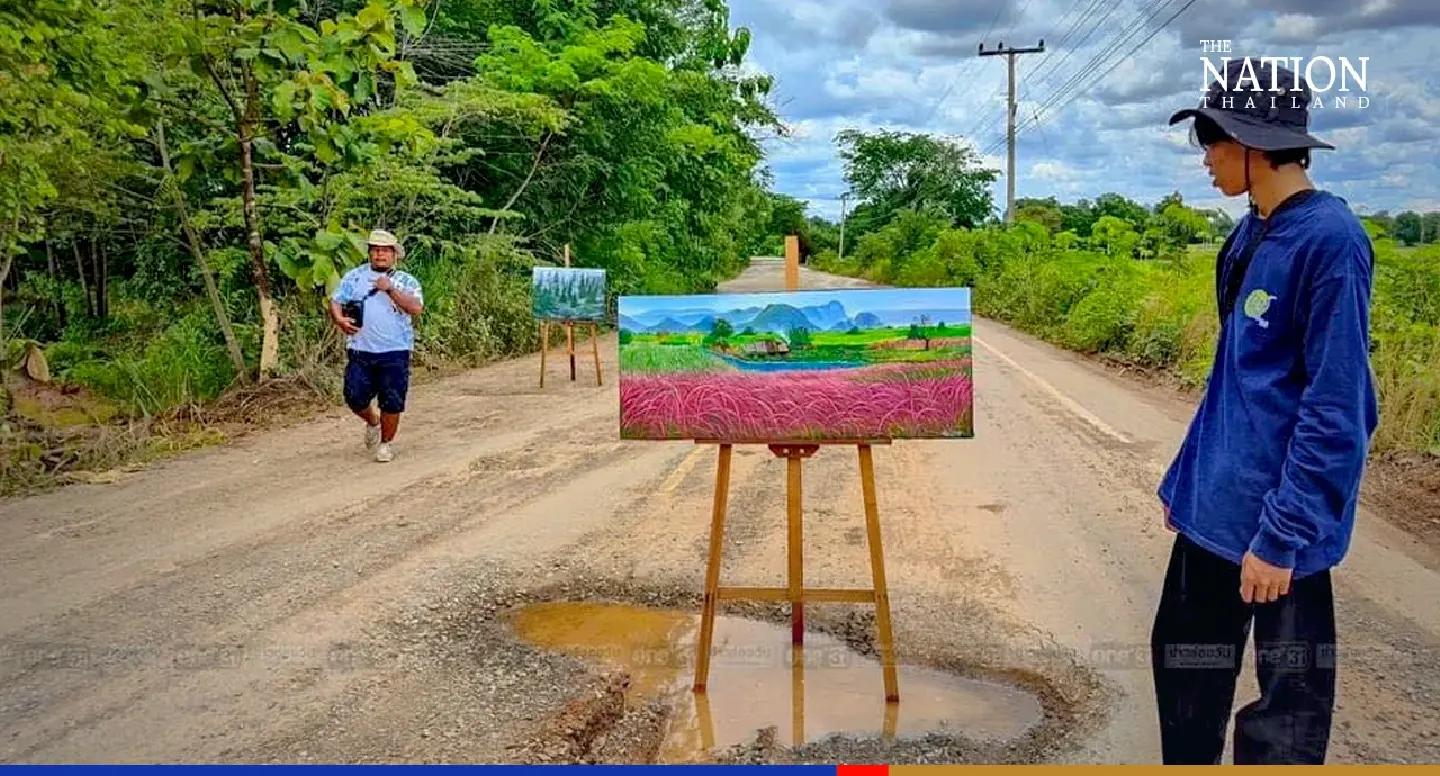 Khon Kaen artist paints to protest against potholes