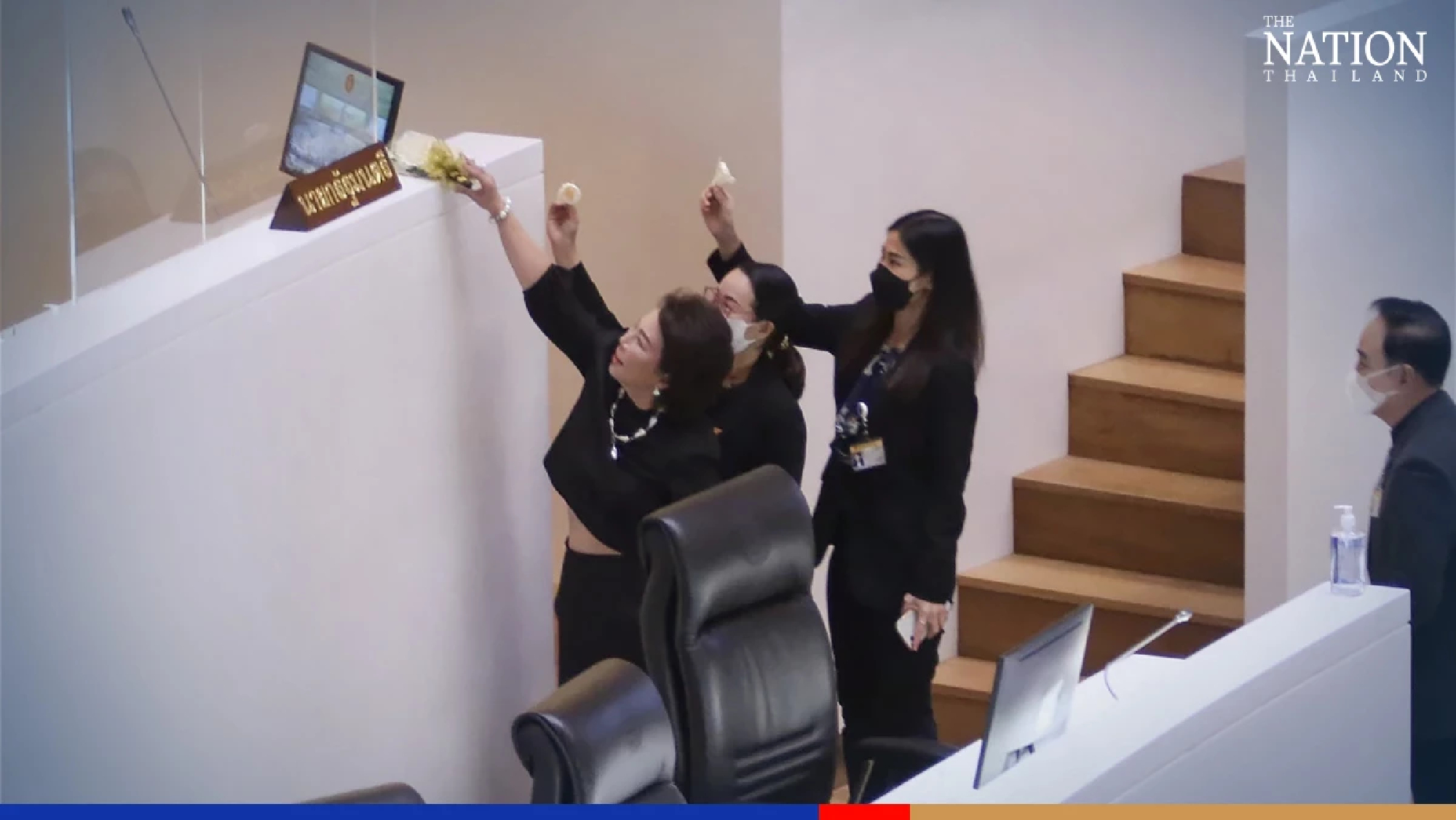 Opposition MPs place cremation flowers at Prayut’s Parliament podium