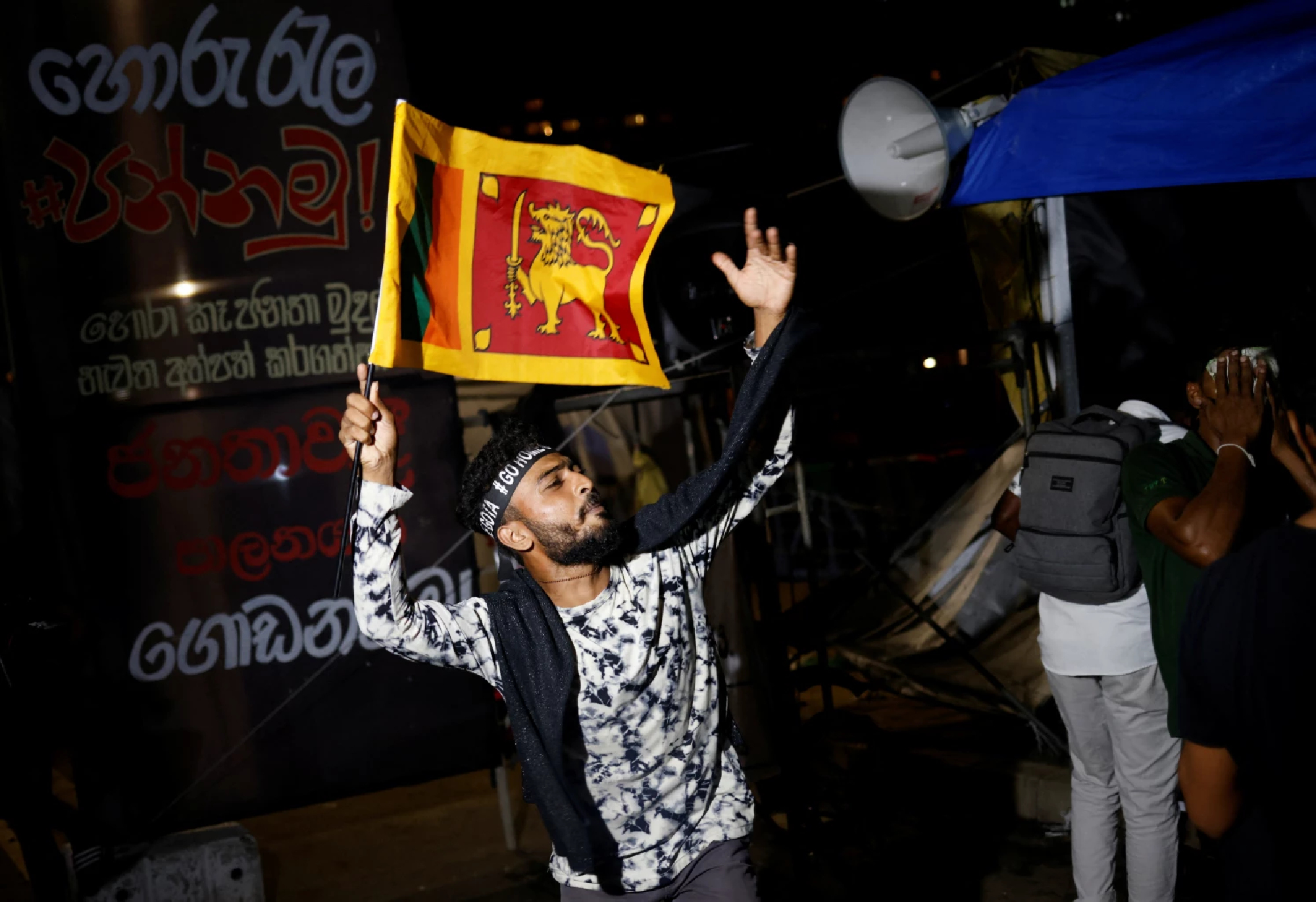 People in Colombo celebrate President Rajapaksa's resignation