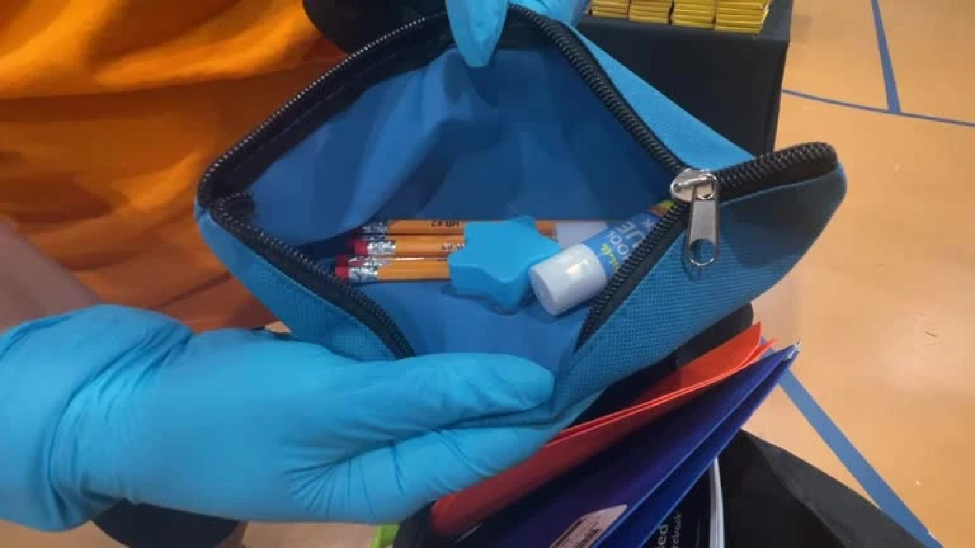 Volunteers fill backpacks to prepare NYC school students for new school year