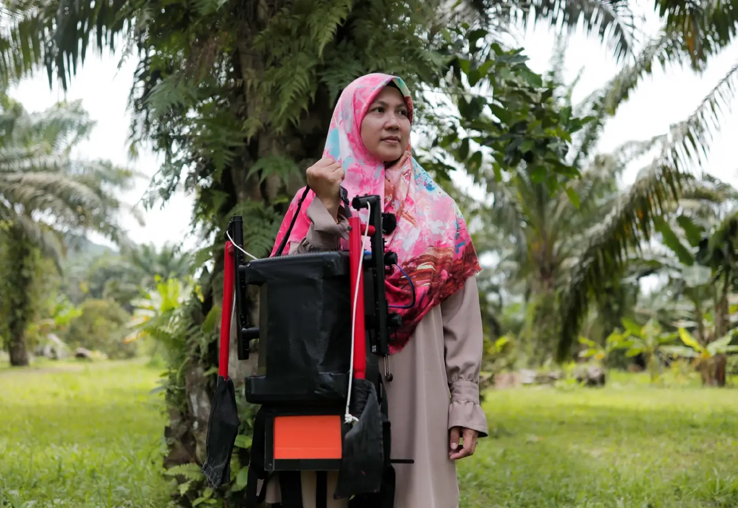 Malaysia unveils exoskeleton to boost palm oil harvesting amid labour crunch