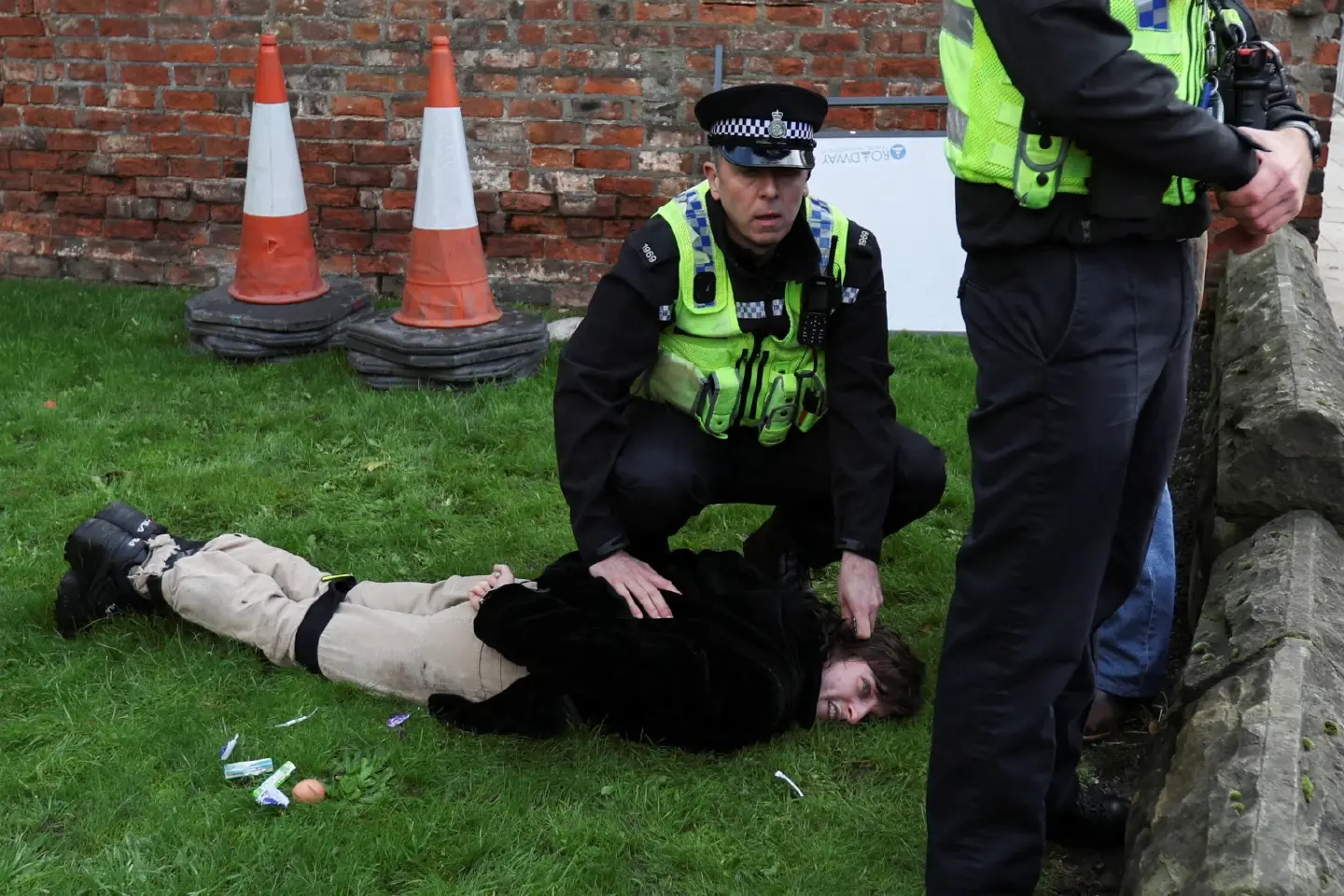 Man held after eggs thrown at King Charles Man held after eggs thrown at King Charles