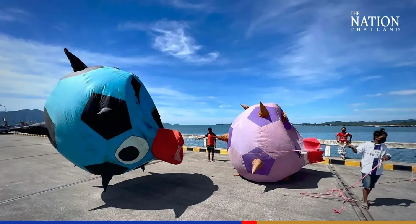 Kites rise and swoop in sea breeze at Trat province festival