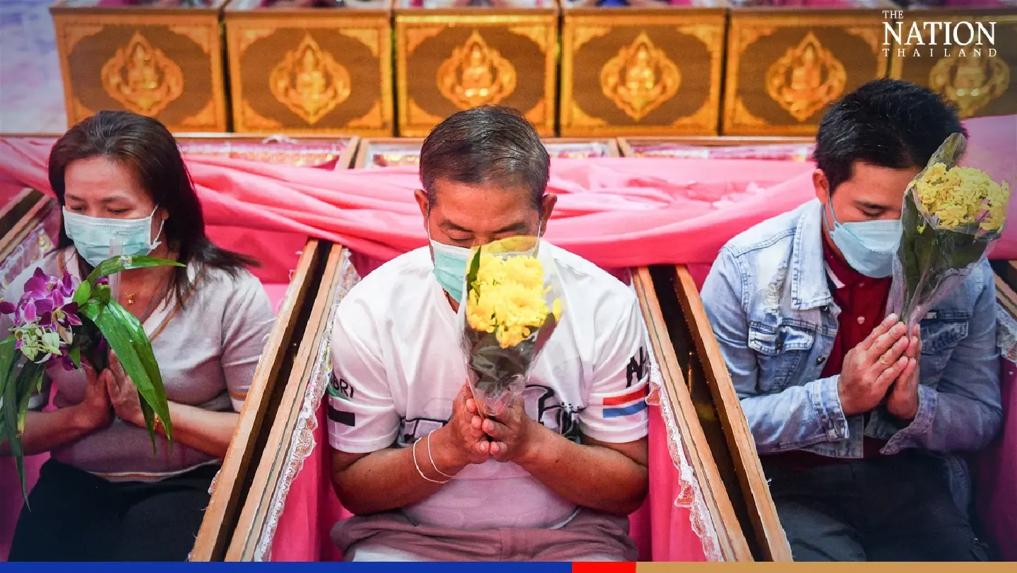 Devotees climb into coffins for Thailand’s strangest New Year ceremony Devotees climb into coffins for Thailand’s strangest New Year ceremony