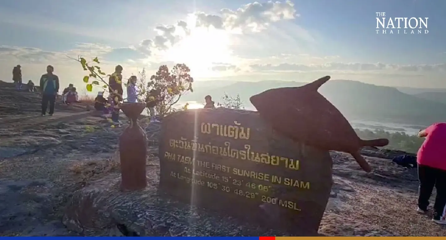 Tourists gather on a sacred mountain in Ubon for New Year sunrise