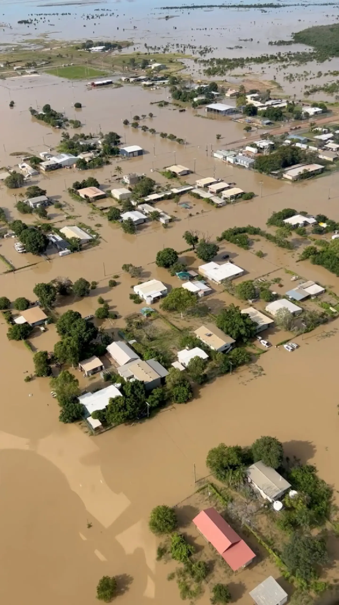 Residents evacuated as record-breaking flood engulfs Australian town