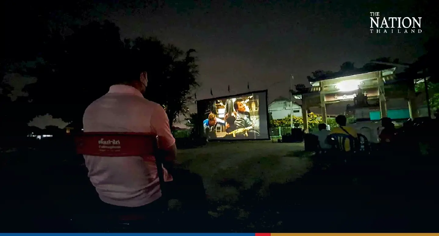 In Phitsanulok graveyard, lights flicker as dead join the living for movie night