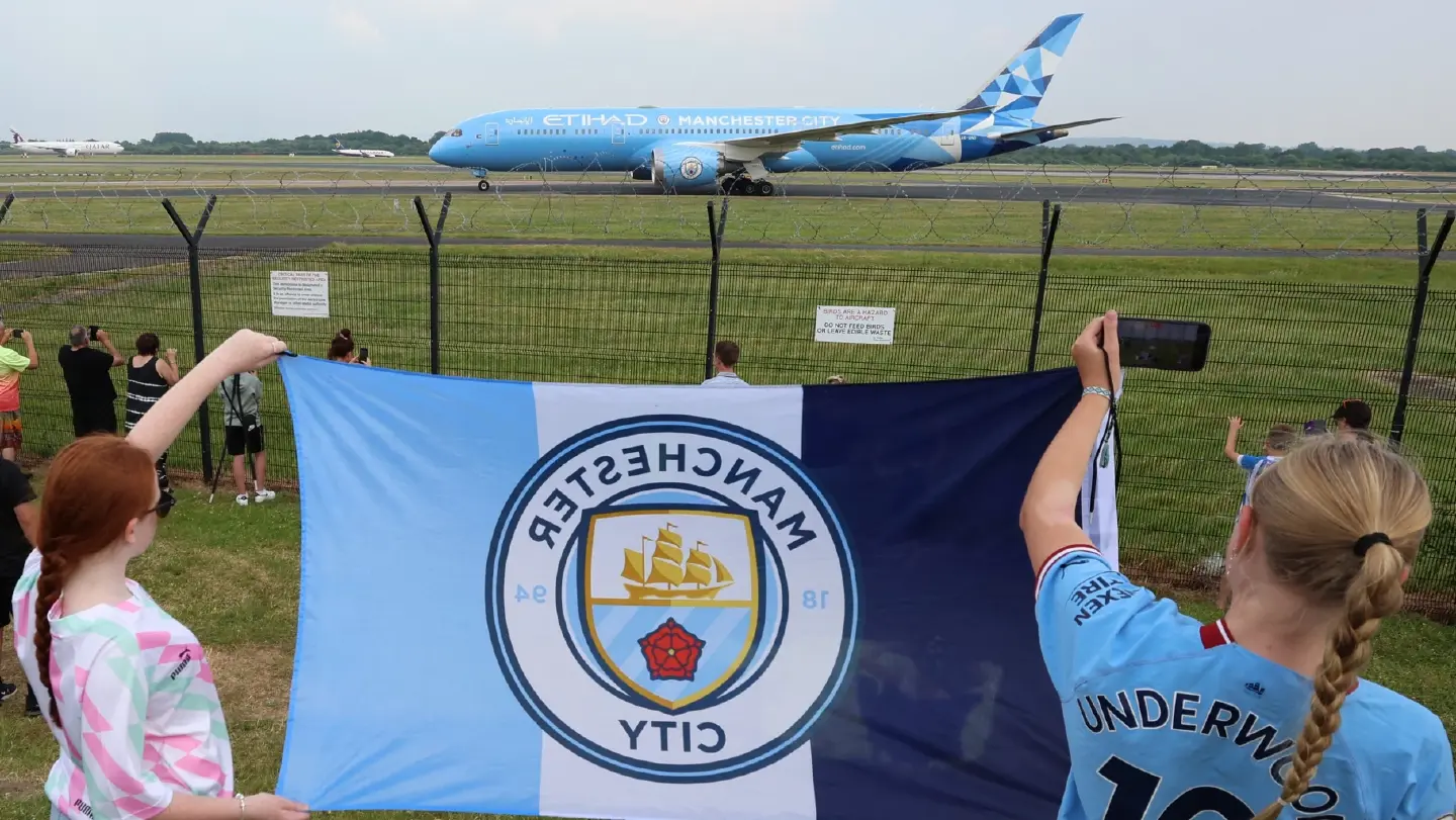 Treble winning Man City arrive home with Champions League trophy