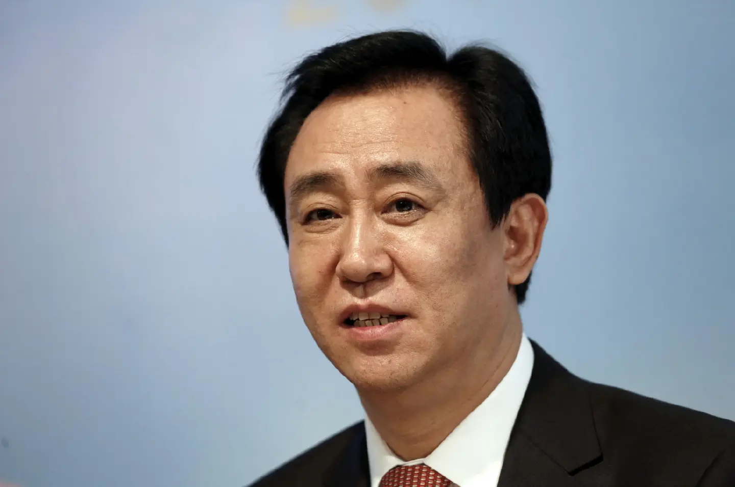 Evergrande shares halted trading amid reports of detained boss