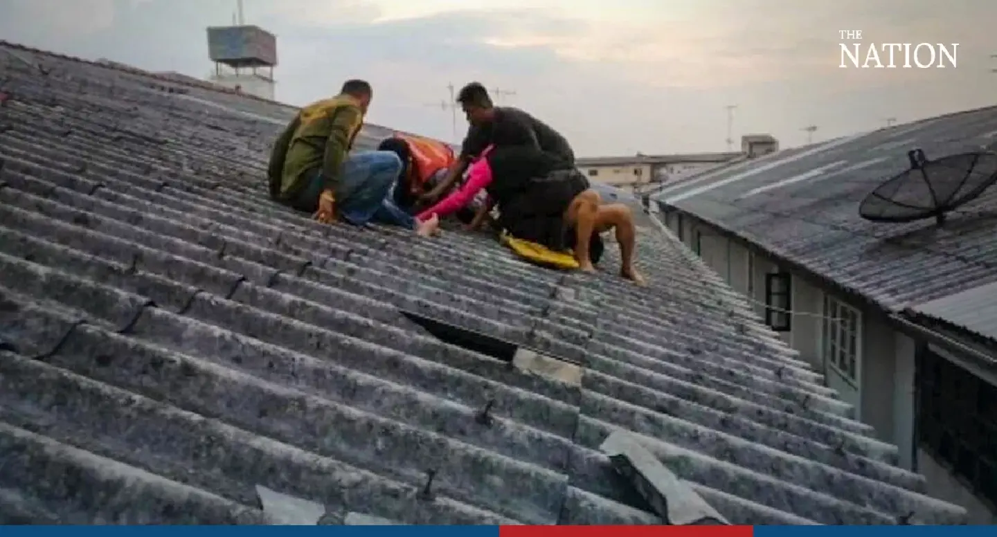 Rescuers in 3-hour standoff with suicidal Filipino on rooftop in Bangkok suburbs